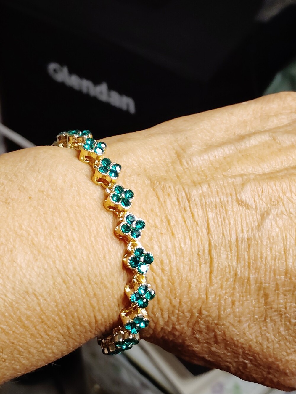 Gold-Tone Bracelet with Emerald Green Crystal Flower Motifs